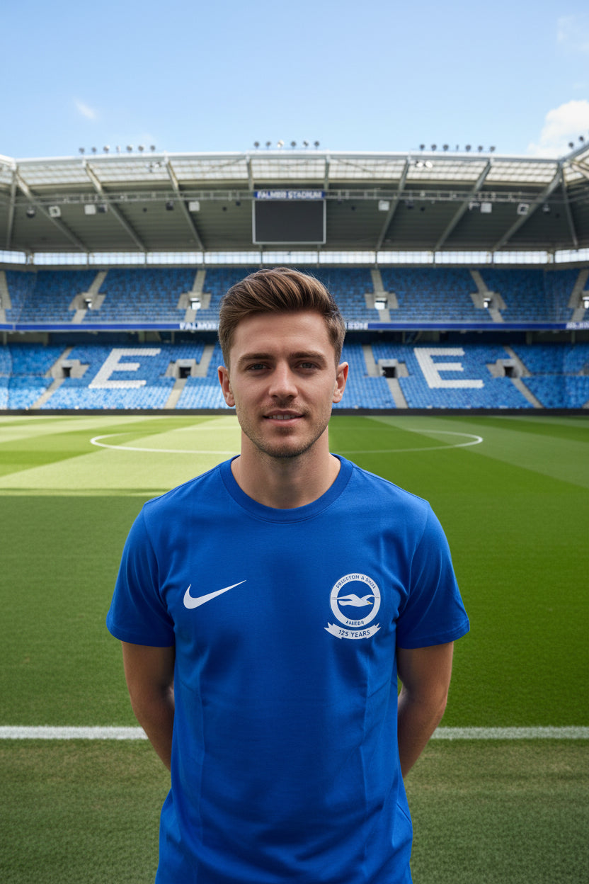 A blue short-sleeve Nike T-shirt with a white swoosh and Brighton & Hove Albion R.F.